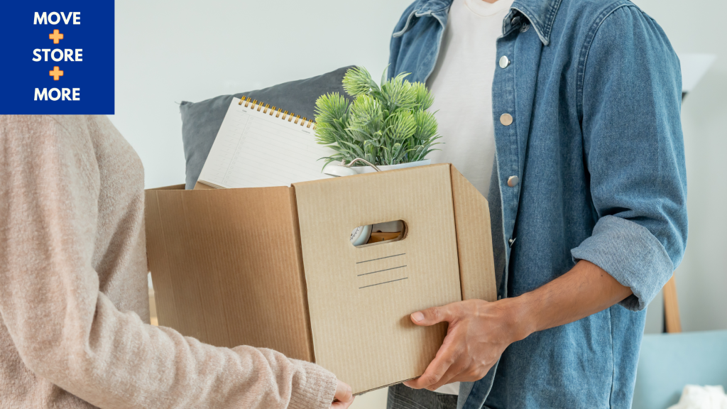  Image of people organising items into moving boxes.