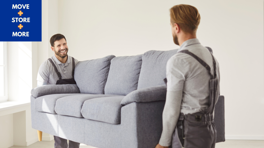 Image of a removal team moving a settee/couch.