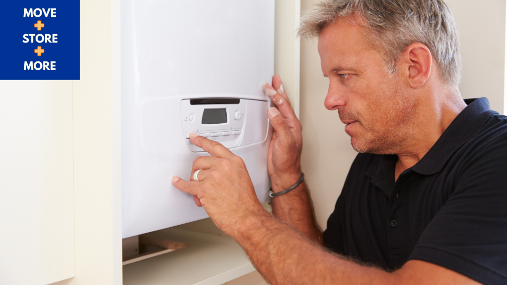 Image of man checking a boiler.