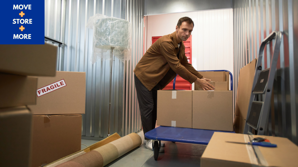 Image of a man sorting boxes in an organised storage unit with labelled boxes - Move Store & More How to Save Money Before Moving House Blog Image